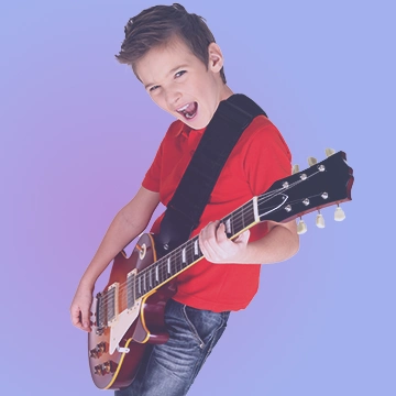 Enfant jouant de la guitare avec Acadomia